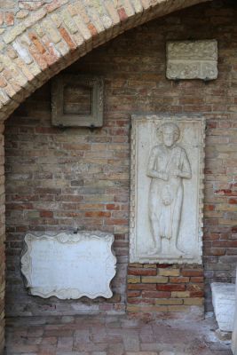 Exterior of the room under the stairs of the Palazzo dell'Archivio – Saint Bartholomew, bas-relief of the 15th C. - Island of Torcello, Venice
