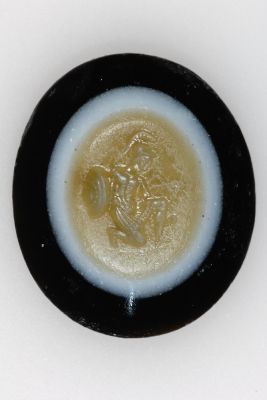 Carved agate with kneeling warrior with armor and shield, 2nd-1st century BC. Probably used as a seal – Archaeological Section, Torcello Museum, Venice
